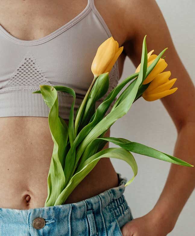 Healthy tummy, flowers on women's body
